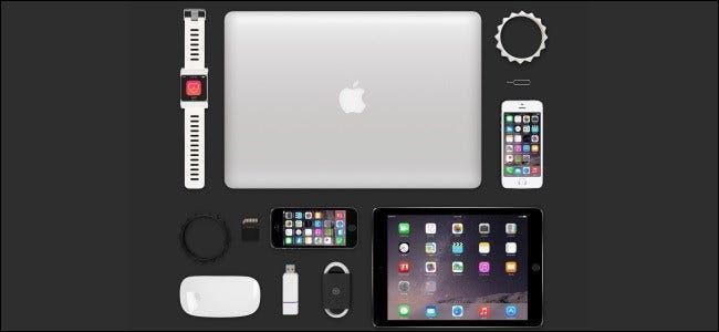 Ein MacBook, iPad, Apple Watch, mehrere iPhones und weiteres Apple-Zubehör auf einem Tisch.